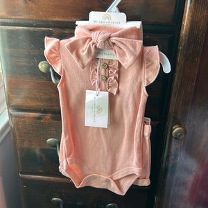 Peach colored body suit & short set with matching bow headband size 3-6 months